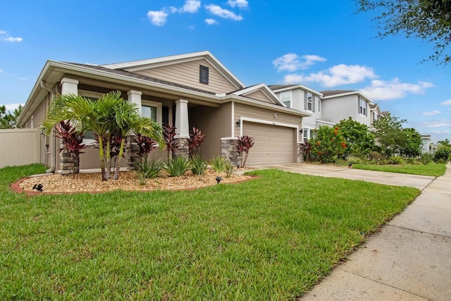 5006 Jackel Chase Dr, Wimauma, FL 33598 - view of front of property featuring concrete driveway, an attached garage, stone siding, and stucco siding