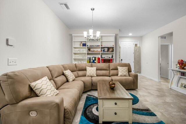 5006 Jackel Chase Dr, Wimauma, FL 33598 - living room featuring a chandelier and baseboards