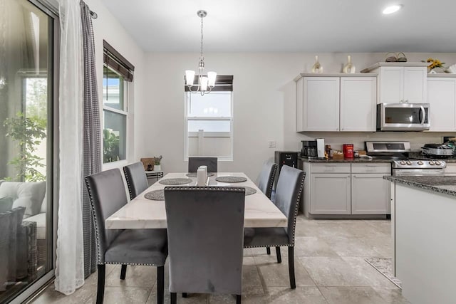 5006 Jackel Chase Dr, Wimauma, FL 33598 - dining room with a chandelier and recessed lighting
