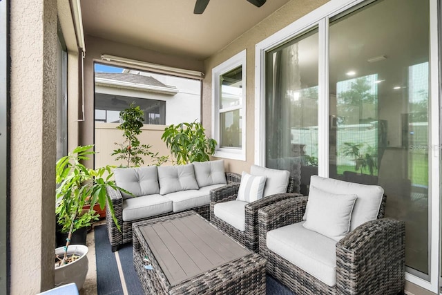 5006 Jackel Chase Dr, Wimauma, FL 33598 - balcony with ceiling fan and an outdoor hangout area