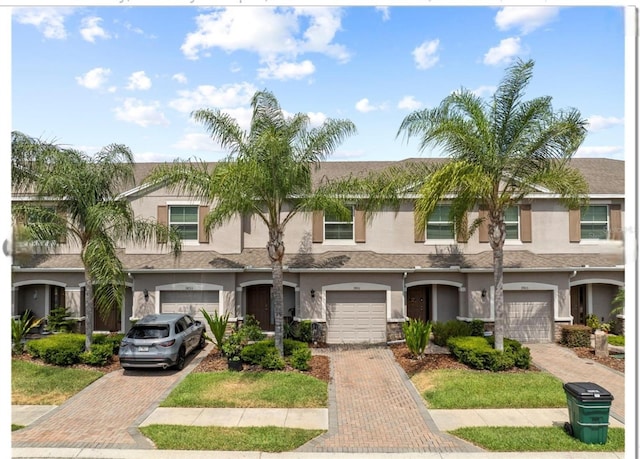 3901 Silverlake Way, Wesley Chapel, FL 33544 - multi unit property with driveway, stucco siding, and an attached garage