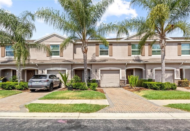 3901 Silverlake Way, Wesley Chapel, FL 33544 - multi unit property with driveway, stucco siding, and an attached garage