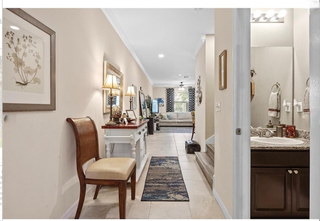 3901 Silverlake Way, Wesley Chapel, FL 33544 - corridor featuring a sink, crown molding, light tile patterned floors, and baseboards