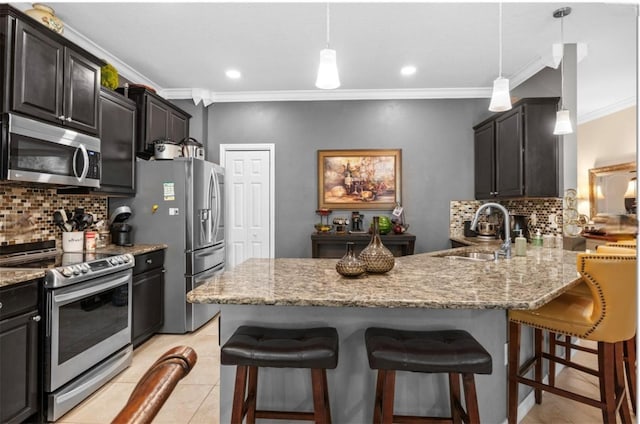 3901 Silverlake Way, Wesley Chapel, FL 33544 - kitchen with stainless steel appliances, a sink, backsplash, crown molding, and light stone counters