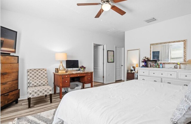 3901 Silverlake Way, Wesley Chapel, FL 33544 - bedroom featuring light wood-style floors and ceiling fan