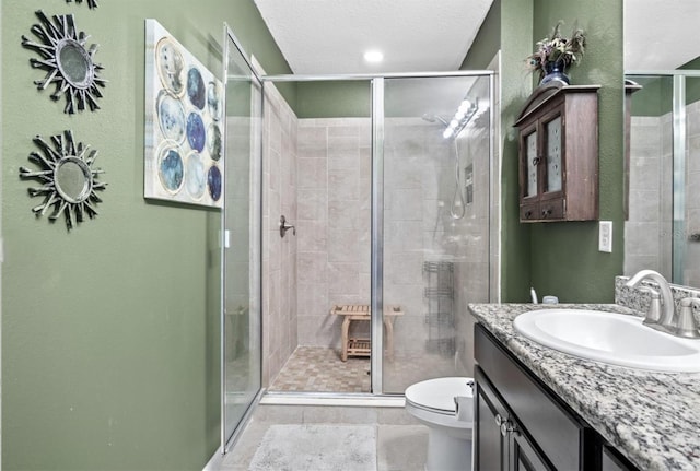 3901 Silverlake Way, Wesley Chapel, FL 33544 - bathroom featuring toilet, vanity, a stall shower, and tile patterned flooring