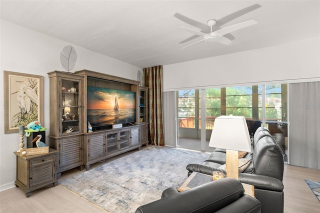 6330 99th Way N Unit 14B, Seminole, FL 33708 - living room with ceiling fan and light wood finished floors