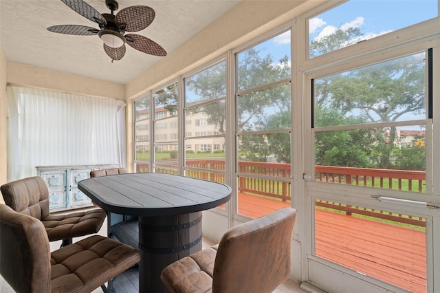 6330 99th Way N Unit 14B, Seminole, FL 33708 - sunroom / solarium with a ceiling fan and outdoor dining space
