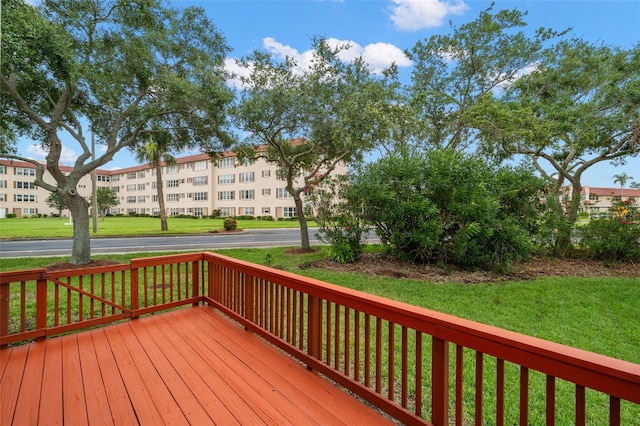6330 99th Way N Unit 14B, Seminole, FL 33708 - wooden deck featuring a yard