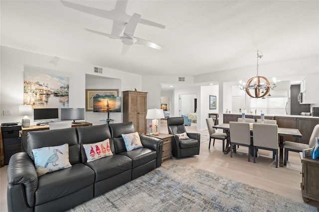 6330 99th Way N Unit 14B, Seminole, FL 33708 - living area featuring a chandelier and ceiling fan