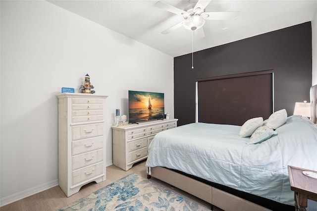 6330 99th Way N Unit 14B, Seminole, FL 33708 - bedroom featuring baseboards, light wood-style flooring, and a ceiling fan