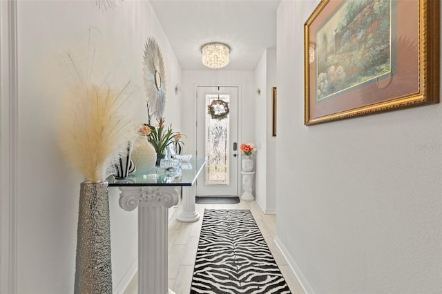 944 Old Windsor Way, Spring Hill, FL 34609 - entryway featuring baseboards, a chandelier, and light tile patterned floors
