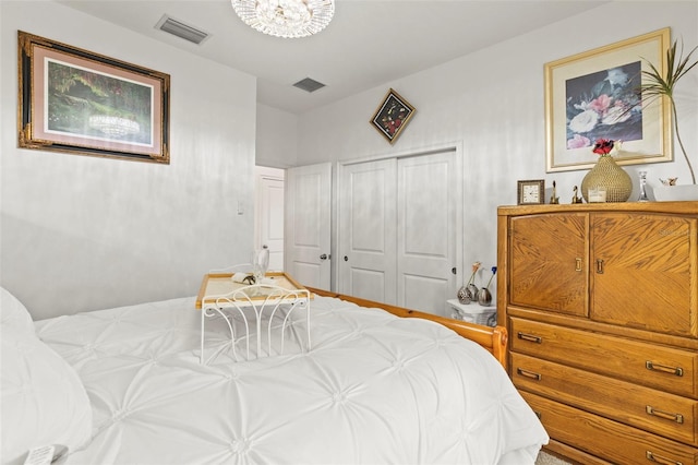 944 Old Windsor Way, Spring Hill, FL 34609 - bedroom featuring a chandelier and a closet