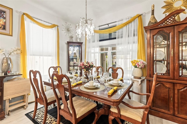944 Old Windsor Way, Spring Hill, FL 34609 - dining space featuring healthy amount of natural light, a chandelier, and light wood-type flooring