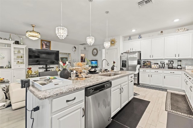 944 Old Windsor Way, Spring Hill, FL 34609 - kitchen featuring appliances with stainless steel finishes, a sink, white cabinetry, decorative backsplash, and recessed lighting