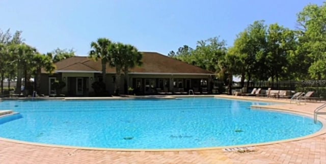 944 Old Windsor Way, Spring Hill, FL 34609 - community pool with a patio