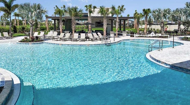 33306 Castaway Loop, Wesley Chapel, FL 33543 - community pool featuring a patio