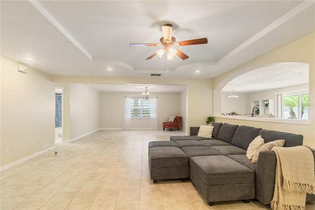 39721 Meadowood Loop, Zephyrhills, FL 33542 - living area featuring a tray ceiling, a chandelier, a ceiling fan, recessed lighting, and baseboards