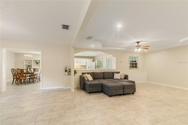 39721 Meadowood Loop, Zephyrhills, FL 33542 - living area featuring ceiling fan, a chandelier, light tile patterned floors, recessed lighting, and arched walkways
