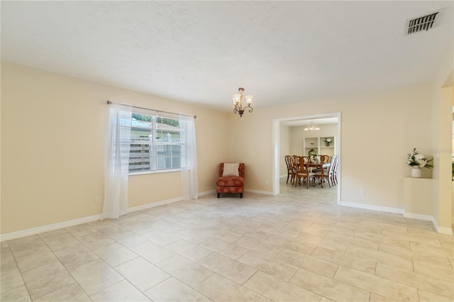 39721 Meadowood Loop, Zephyrhills, FL 33542 - living area featuring a chandelier, light tile patterned floors, and baseboards