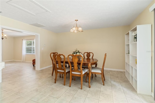 39721 Meadowood Loop, Zephyrhills, FL 33542 - dining area featuring a chandelier and baseboards