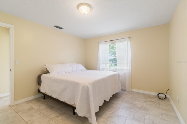 39721 Meadowood Loop, Zephyrhills, FL 33542 - bedroom featuring light tile patterned floors and baseboards