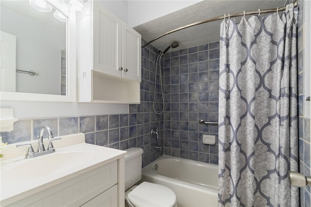39721 Meadowood Loop, Zephyrhills, FL 33542 - full bathroom featuring shower / tub combo with curtain, toilet, tile walls, vanity, and a textured ceiling