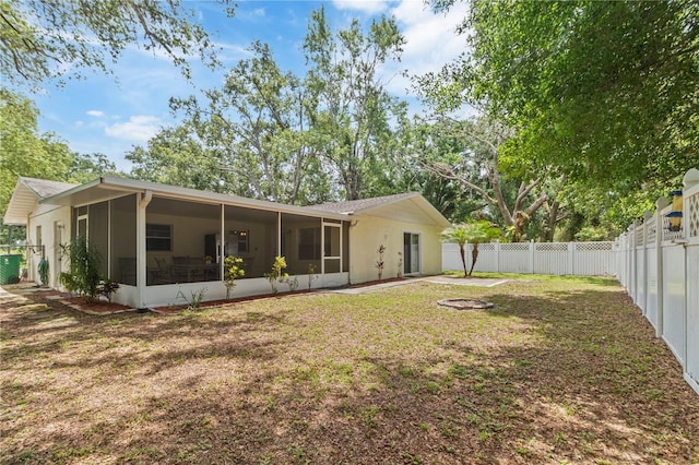39721 Meadowood Loop, Zephyrhills, FL 33542 - back of house with a sunroom