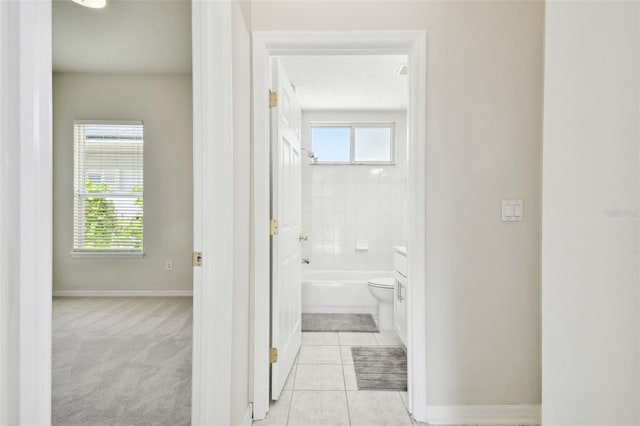 10244 Shadow Branch Dr, Tampa, FL 33647 - full bath with baseboards, toilet, vanity, and tile patterned floors