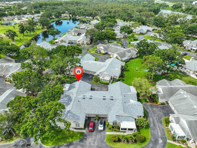 1111 Golfview Woods Dr Unit 1111, Sun City Center, FL 33573 - aerial perspective of suburban area with a nearby body of water