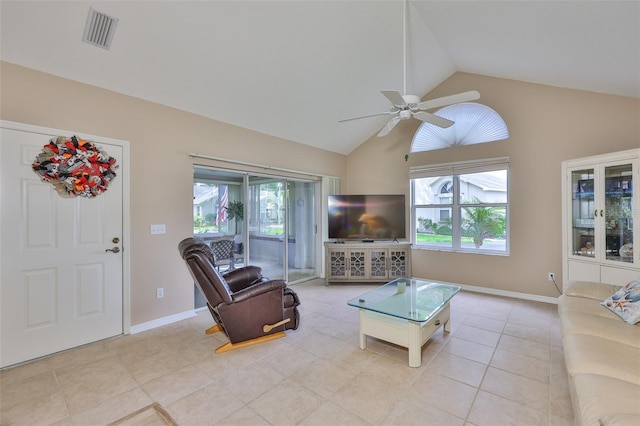 1111 Golfview Woods Dr Unit 1111, Sun City Center, FL 33573 - living area featuring plenty of natural light, ceiling fan, light tile patterned flooring, high vaulted ceiling, and baseboards