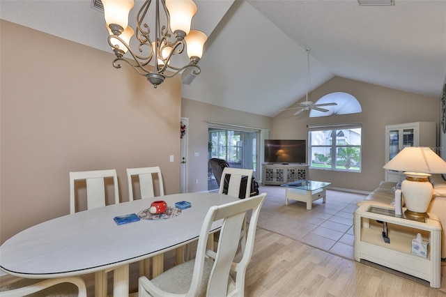 1111 Golfview Woods Dr Unit 1111, Sun City Center, FL 33573 - dining space featuring vaulted ceiling, plenty of natural light, light wood-type flooring, a chandelier, and ceiling fan