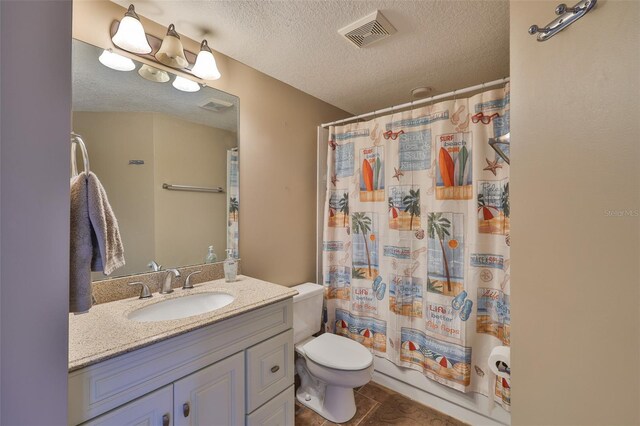 1111 Golfview Woods Dr Unit 1111, Sun City Center, FL 33573 - full bath with vanity, a textured ceiling, toilet, and tile patterned floors