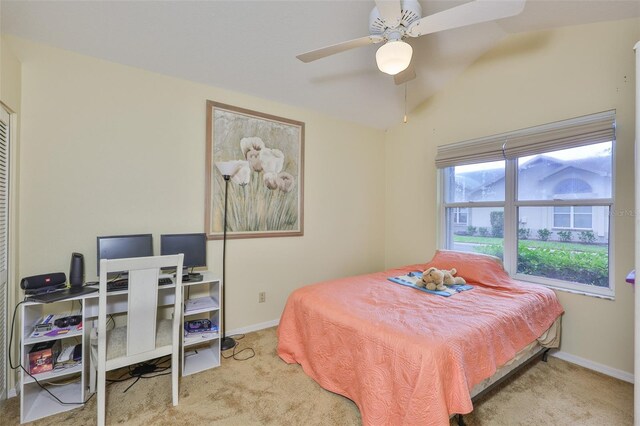 1111 Golfview Woods Dr Unit 1111, Sun City Center, FL 33573 - carpeted bedroom with baseboards, a desk, a ceiling fan, and lofted ceiling