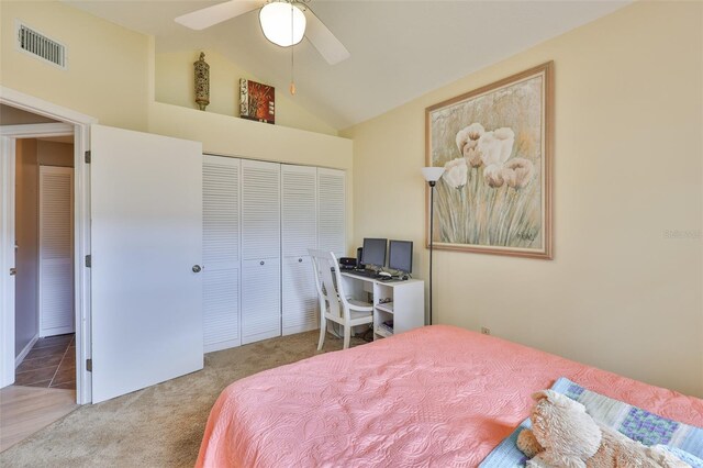 1111 Golfview Woods Dr Unit 1111, Sun City Center, FL 33573 - bedroom featuring carpet, vaulted ceiling, a closet, and ceiling fan