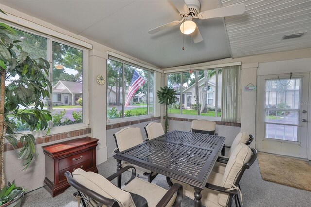 1111 Golfview Woods Dr Unit 1111, Sun City Center, FL 33573 - sunroom / solarium with healthy amount of natural light and carpet flooring