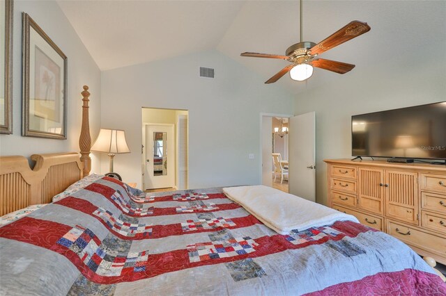 1111 Golfview Woods Dr Unit 1111, Sun City Center, FL 33573 - bedroom featuring vaulted ceiling, a ceiling fan, and a chandelier