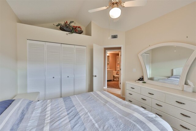 1111 Golfview Woods Dr Unit 1111, Sun City Center, FL 33573 - bedroom featuring vaulted ceiling, a closet, and a ceiling fan