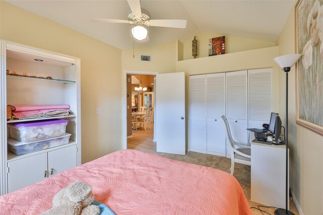 1111 Golfview Woods Dr Unit 1111, Sun City Center, FL 33573 - bedroom featuring a chandelier, carpet flooring, a closet, a ceiling fan, and high vaulted ceiling