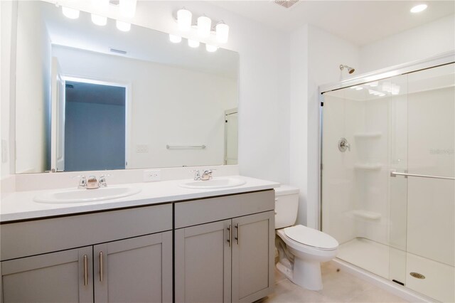 34234 Polacca Ln, Wesley Chapel, FL 33543 - full bathroom with double vanity, a stall shower, and tile patterned flooring
