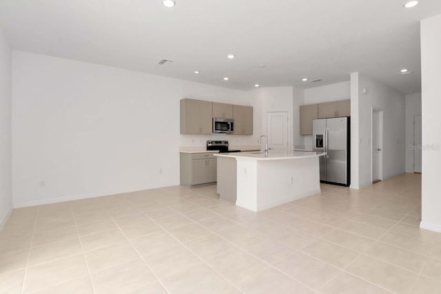 34234 Polacca Ln, Wesley Chapel, FL 33543 - kitchen with appliances with stainless steel finishes, recessed lighting, light countertops, open floor plan, and a center island with sink