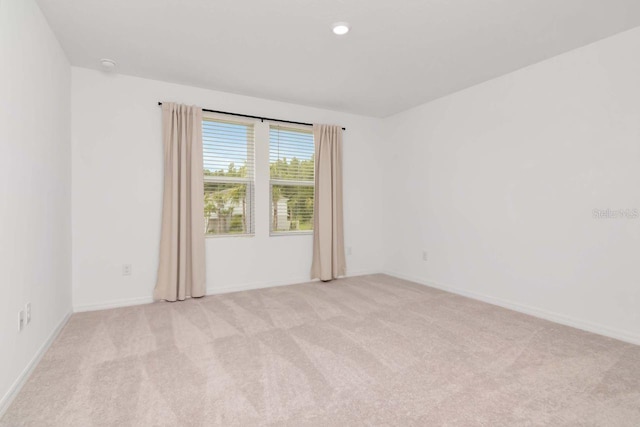 34234 Polacca Ln, Wesley Chapel, FL 33543 - spare room featuring light colored carpet and baseboards