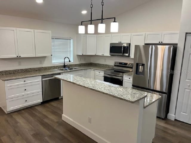 5635 NW 61st Ct, Ocala, FL 34482 - kitchen with appliances with stainless steel finishes, a sink, white cabinets, dark wood-type flooring, and recessed lighting