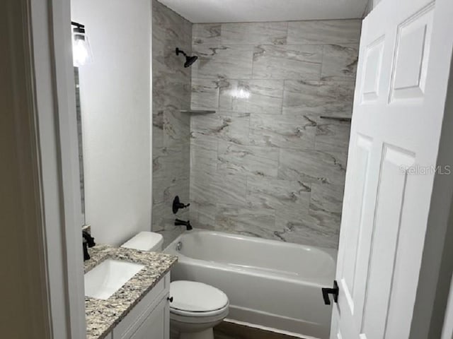 5635 NW 61st Ct, Ocala, FL 34482 - bathroom featuring toilet, vanity, and shower / bathtub combination