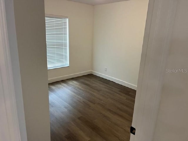 5635 NW 61st Ct, Ocala, FL 34482 - unfurnished room with dark wood-style flooring and baseboards