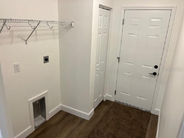 5635 NW 61st Ct, Ocala, FL 34482 - washroom with dark wood-type flooring, baseboards, and hookup for an electric dryer