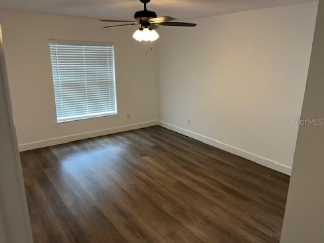 5635 NW 61st Ct, Ocala, FL 34482 - empty room with ceiling fan, baseboards, and dark wood-style floors