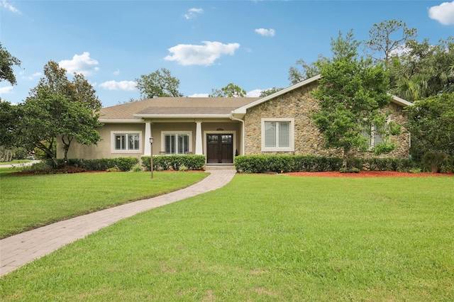 1803 143rd Ct E, Bradenton, FL 34212 - ranch-style home with stone siding, a front lawn, and stucco siding