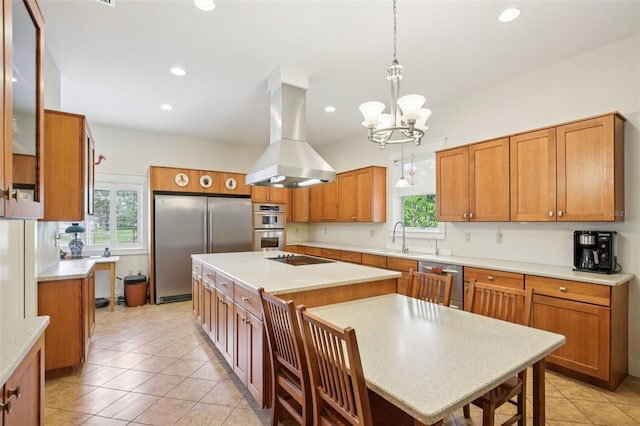 1803 143rd Ct E, Bradenton, FL 34212 - kitchen with island range hood, appliances with stainless steel finishes, a kitchen island, brown cabinetry, and a chandelier