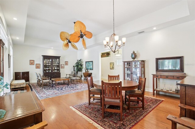 1803 143rd Ct E, Bradenton, FL 34212 - dining area with wood finished floors, recessed lighting, a raised ceiling, a chandelier, and ceiling fan